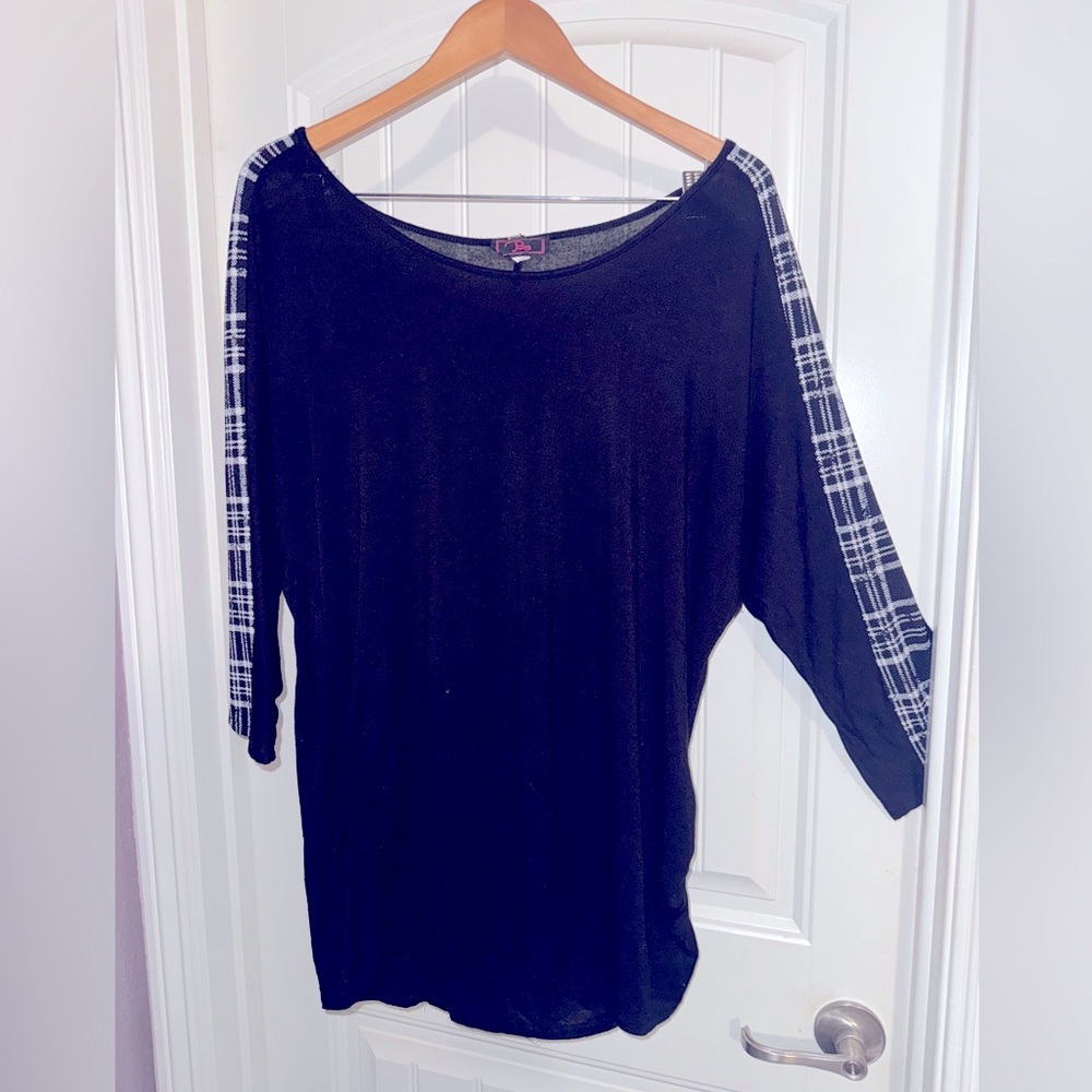 Black boat neck top with black and white plaid stripe down arms